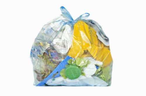 Company van and crew preparing for a commercial waste collection