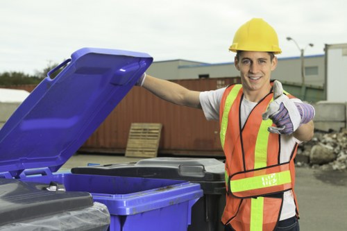 Electric low-emission waste collection van in neighbourhood